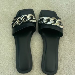 Black and gold flat sandals